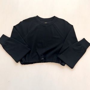 Gilly Hicks by Hollister. Black, long sleeve crop top, with toggle.